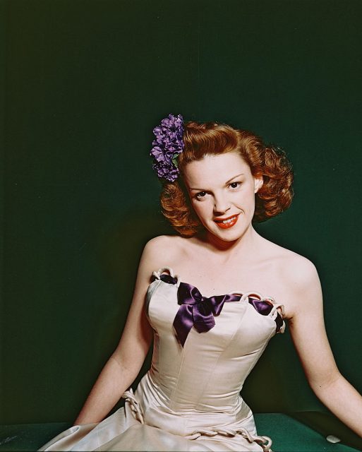 Judy Garland wearing a beige dress