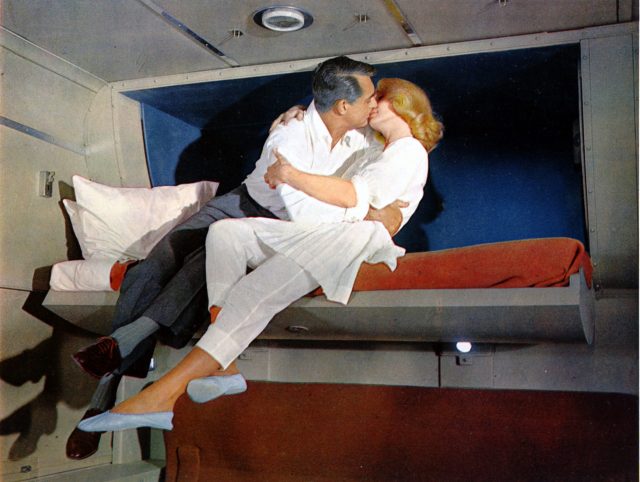 Roger O. Thornhill and Eve Kendall kissing in a train compartment
