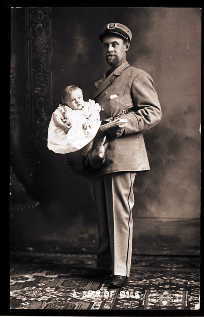 Postman holding a baby