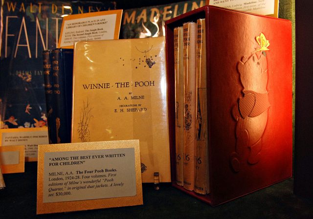 Display of a four-volume set of first edition Winnie-the-Pooh books