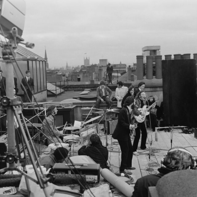 The Beatles performing on the rooftop
