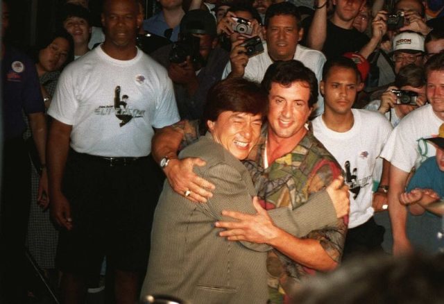 Jackie Chan hugging Sylvester Stallone