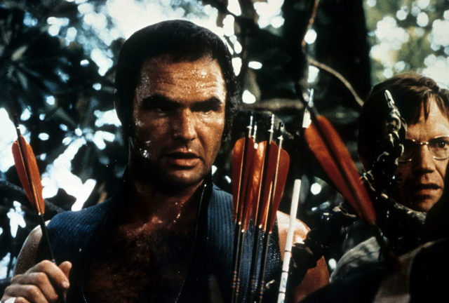 Burt Reynolds holding a quiver of arrows in a scene from 'Deliverance'