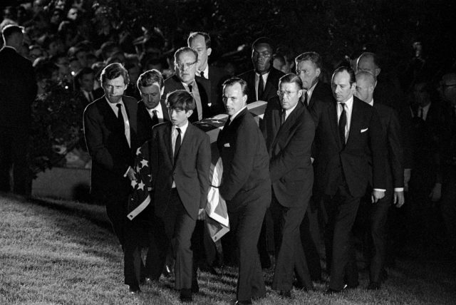 Pallbearers carrying the casket