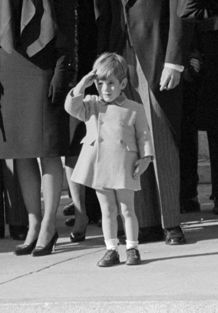 John F. Kennedy Jr., salutes as the casket