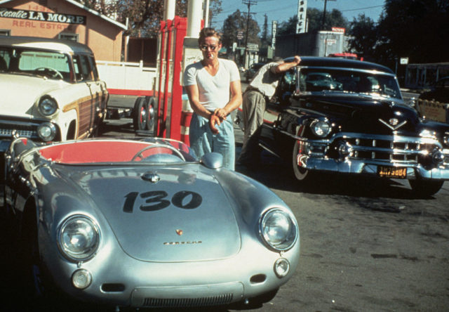 James Dean at a gas station with his silver Porsche 550