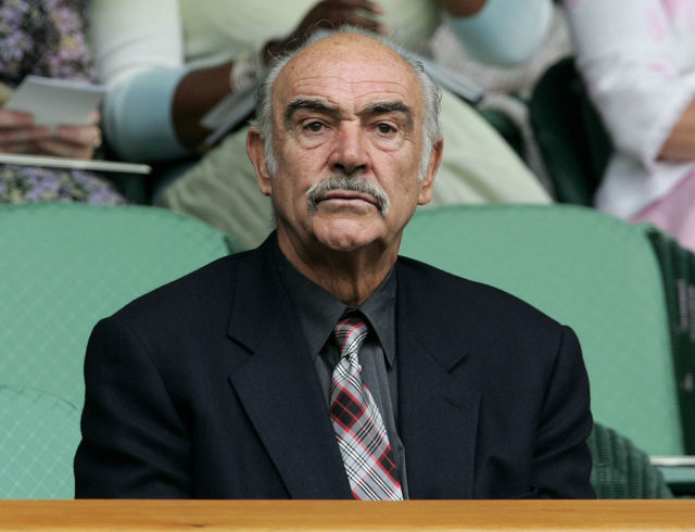 Sean Connery watches a tennis match
