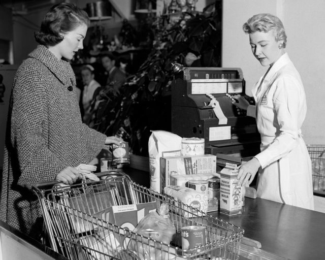 Woman at grocery store checkout