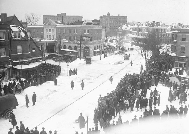 Aerial view of a crowd gathered in the snow
