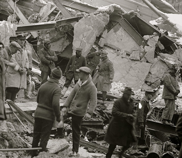 Rescue crews standing amongst the rubble of the Knickerbocker Theater