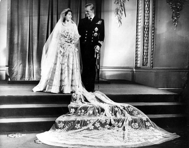 Queen Elizabeth II and Prince Philip smiling at each other on their wedding day