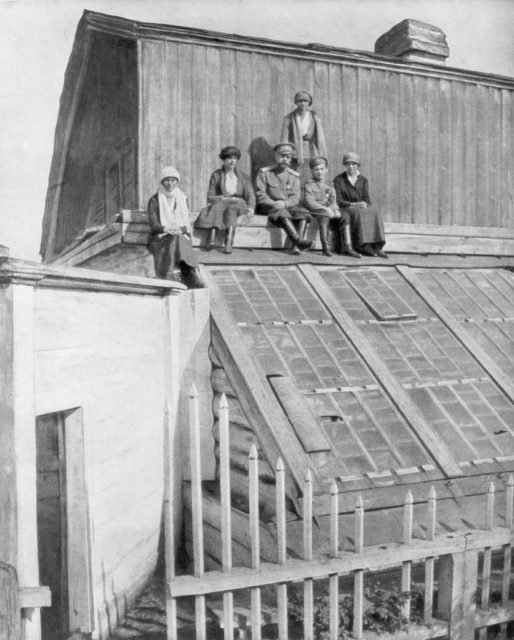 Romanovs sitting on a Green House 