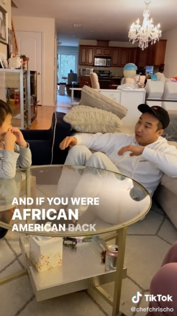 Chris Cho sitting around a glass coffee table with his nephew