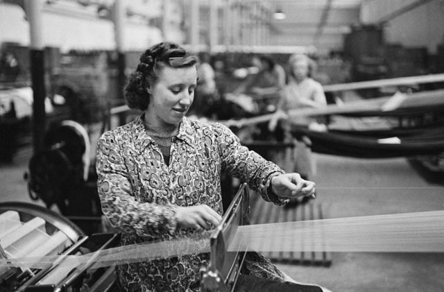 Woman working at a weaving machine