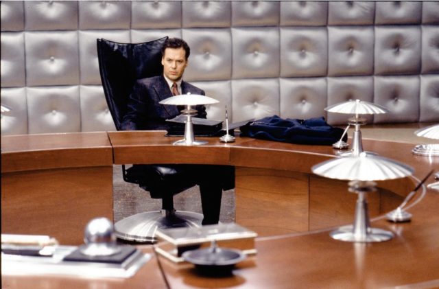 Michael Keaton at a desk