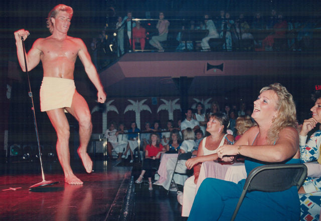 Chippendales dancer standing before an audience of women