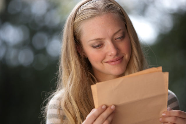 Savannah Lynn Curtis reading a letter