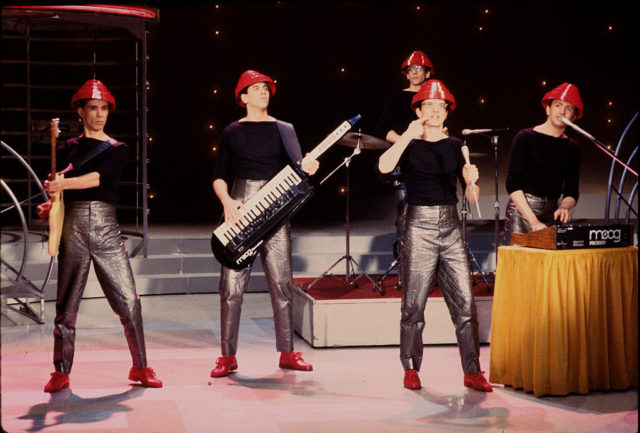 DEVO performing on stage