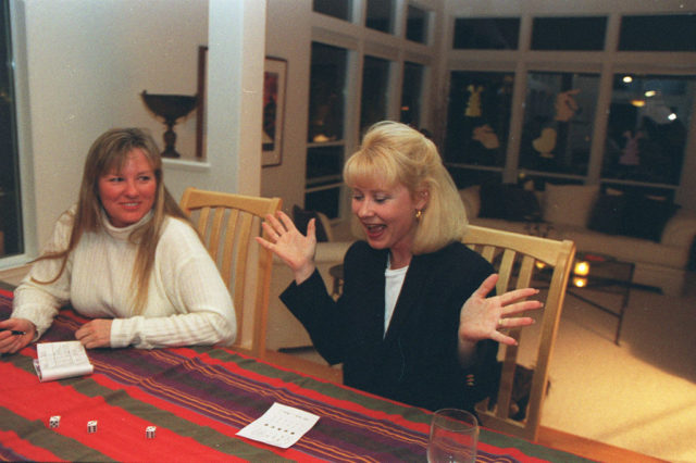 Jan Newton cries out, “Bunco!” after rolling triple threes during a bunco game gathering at her home in Walnut Freek. (Photo Credit: LEA SUZUKI/The San Francisco Chronicle via Getty Images)