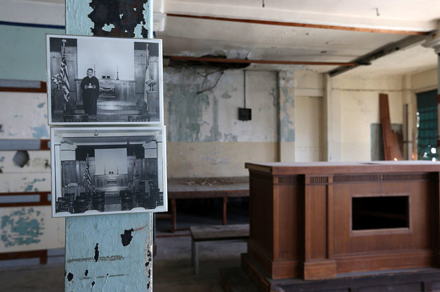 Old photographs are posted in the former chapel at Alcatraz Island on March 21, 2013 in San Francisco, California. The National Park Service marked the 50th anniversary of the closure of the notorious Alcatraz federal penitentiary with an exhibit of newly discovered photos by Los Angeles freelance photographer Leigh Wiener of the prison’s final day in 1963. Alcatraz was first a fort and later became an Army disciplinary barracks before being taken over by the Bureau of Prisons in 1934. (Photo Credit: Justin Sullivan/Getty Images)