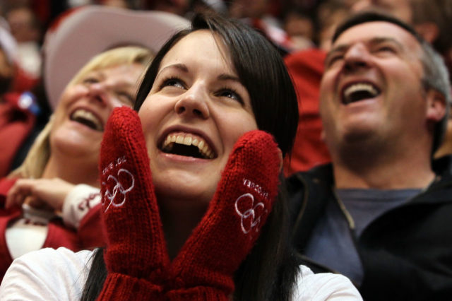 A woman in red mittens