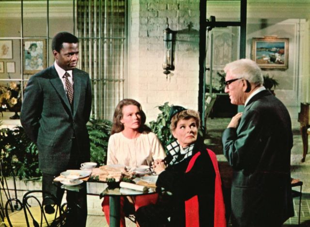 Matt Drayton, John Prentice, Christina Drayton and Joanna Drayton standing around a table