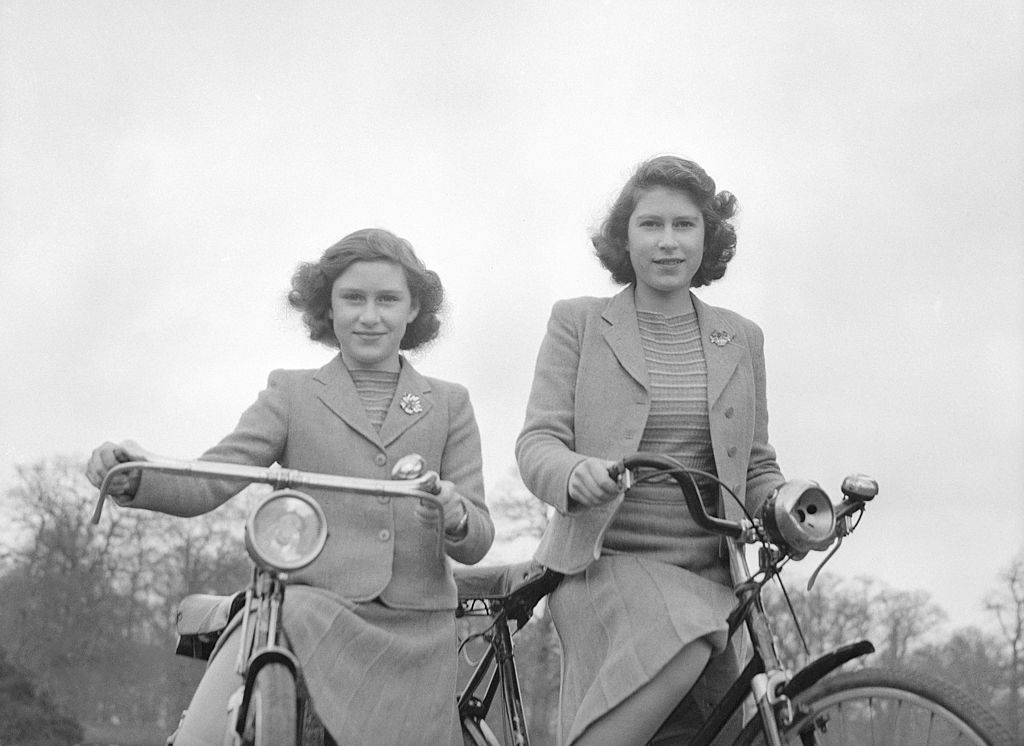 Princess Margaret and Queen Elizabeth on bicycles 