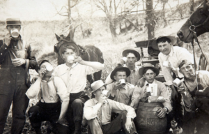 A group of men joking around in the wild west