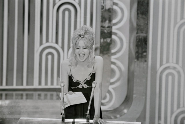 Goldie Hawn standing on stage 