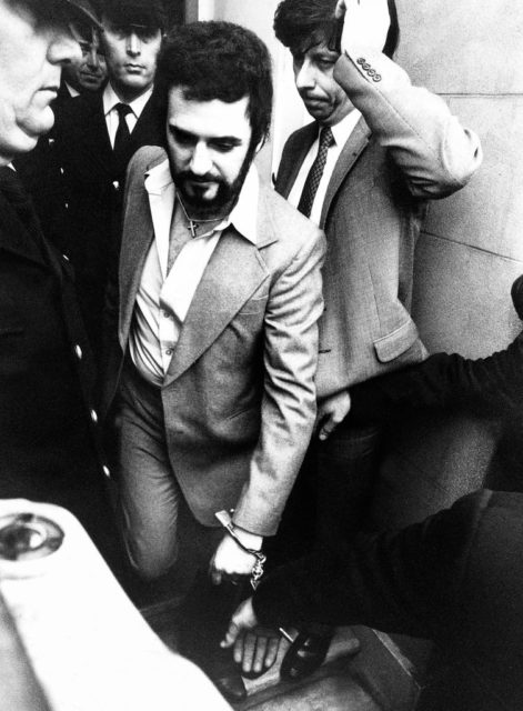 Peter Sutcliffe - the 1970s Jack the Ripper - walking through a crowd of people