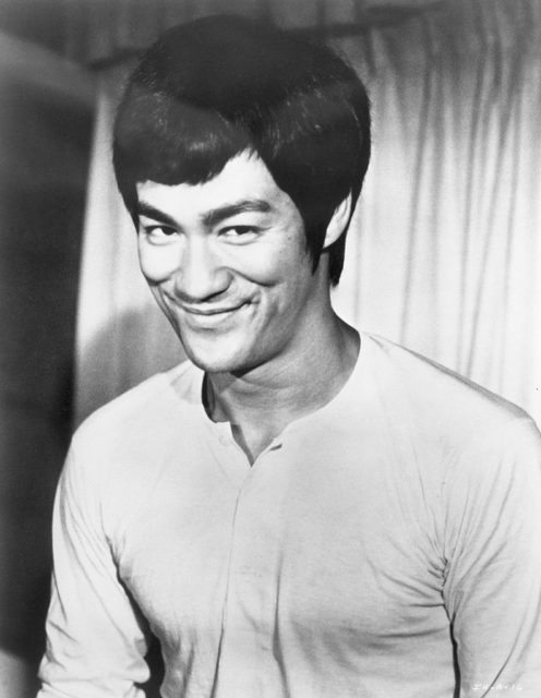Bruce Lee giving a cheeky smile in The Chinese Connection
