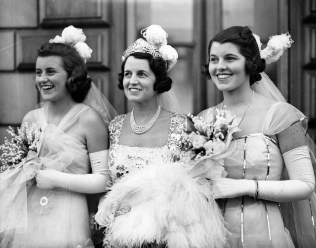 Rose, Kathleen and Rosemary Kennedy standing together in formal attire
