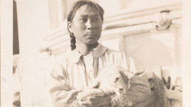 Ada Blackjack and cat Vic, the sole survivors of the Wrangel Island expedition, photographed on their rescue ship.