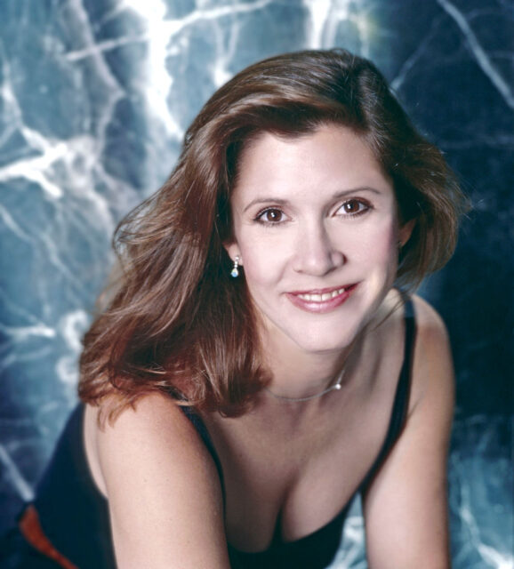 Carrie Fisher posing for the camera in 1985