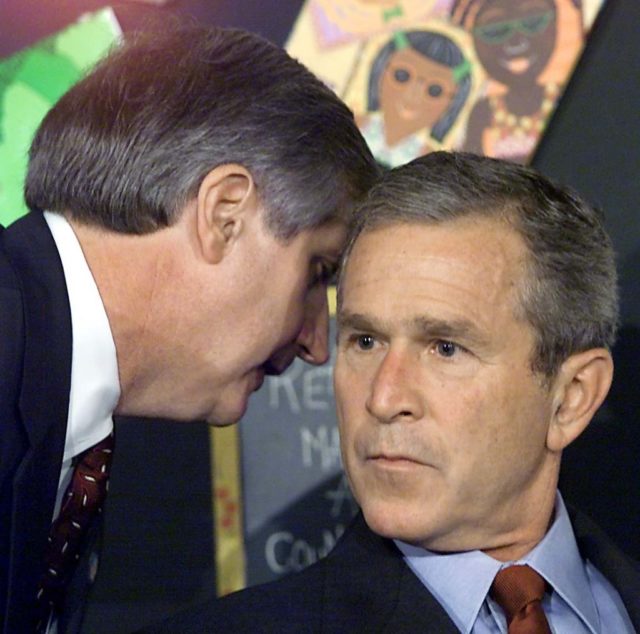 Andrew Card telling George Bush about 9/11