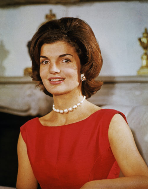 Portrait of Jackie Kennedy in red dress and pearls, 1960.