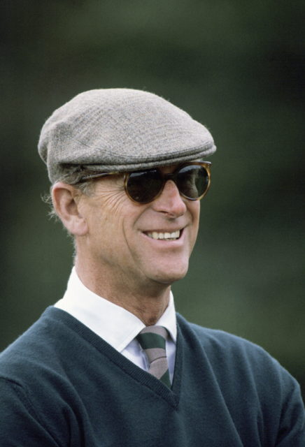 Prince Philip smiling while wearing a hat and sunglasses