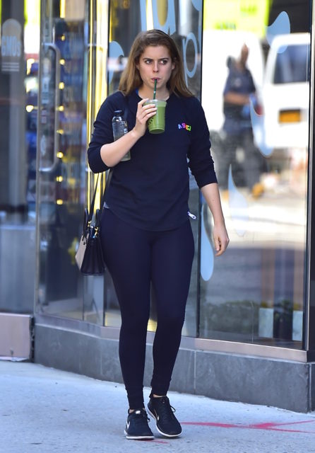 Princess Beatrice taking a sip of a drink