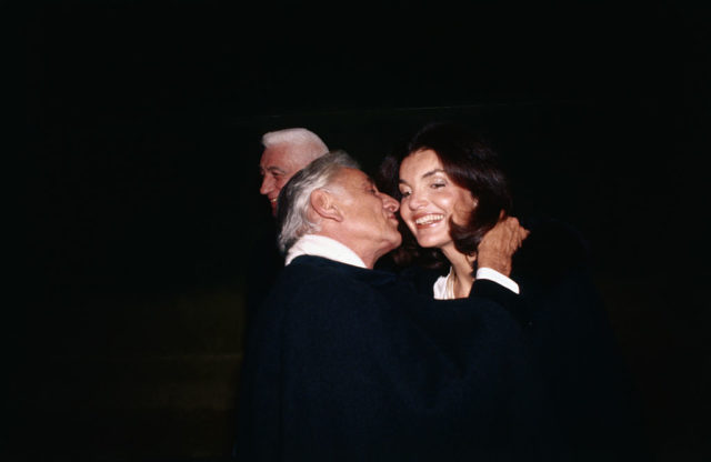 Leonard Bernstein kissing Jackie Kennedy's cheek