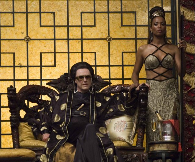 Still of Christopher Walken sitting on a throne with Aisha Tyler beside him from Balls of Fury