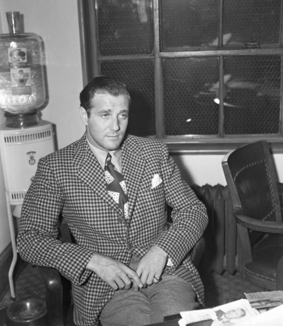 Bugsy Siegel sitting in a chair