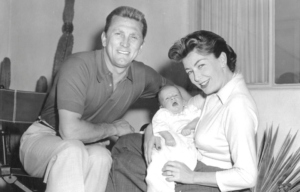 Kirk and Anne Douglas holding their baby