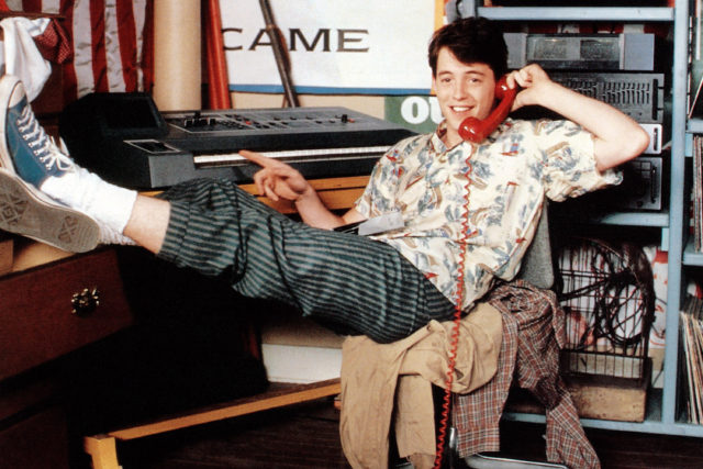 Matthew Broderick as Ferris Bueller poses with a phone