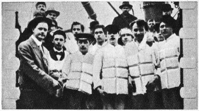 Black and white photo of Titanic crew members in life jackets.