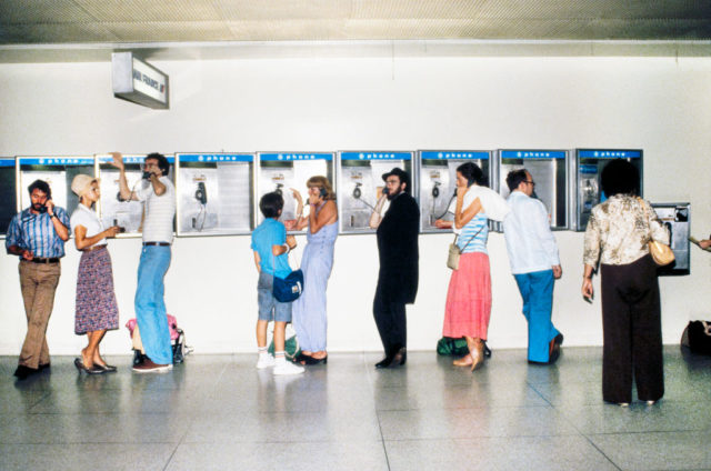 People using payphones