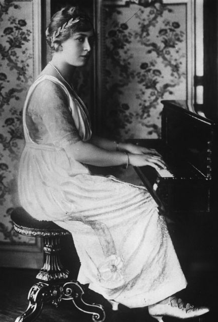 Princess Mary sitting at a piano