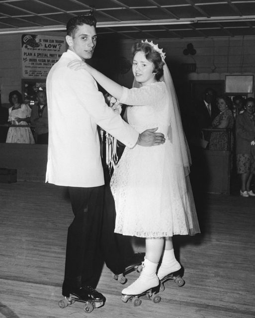 Bride and groom wear rollerskates for their first dance