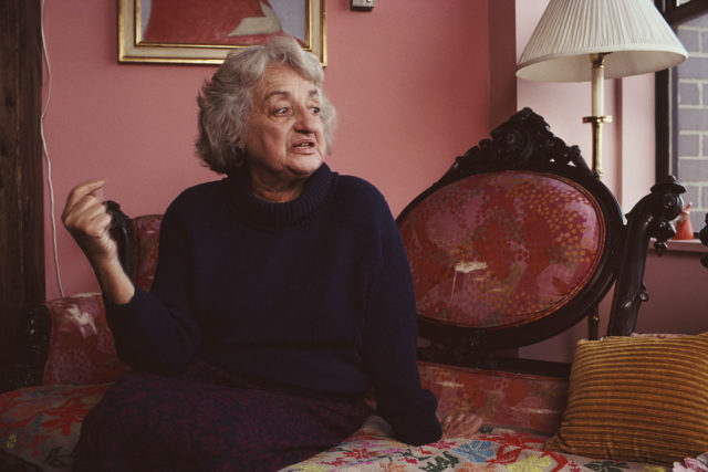 Feminist Betty Friedan sits on a sofa at her New York City apartment in 1990.