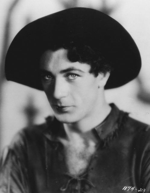 Black and White portrait of Gary Cooper in cowboy attire, circa 1929.