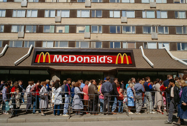 People lining up outside a McDonald's restaurant